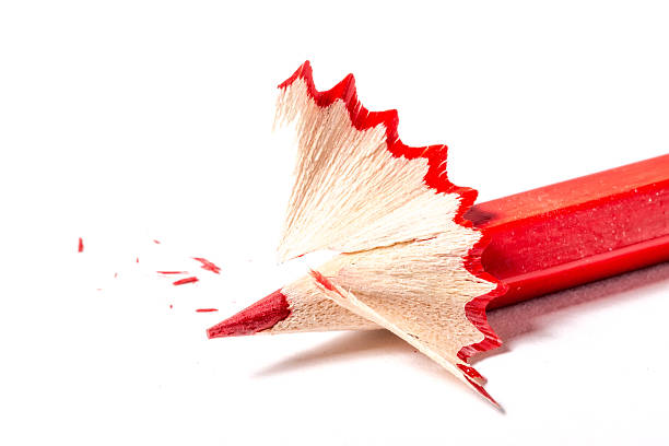 istock Red pencil with shavings on a white background 596055374