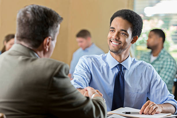 istock Mixed race young adult at a job interview 596055578
