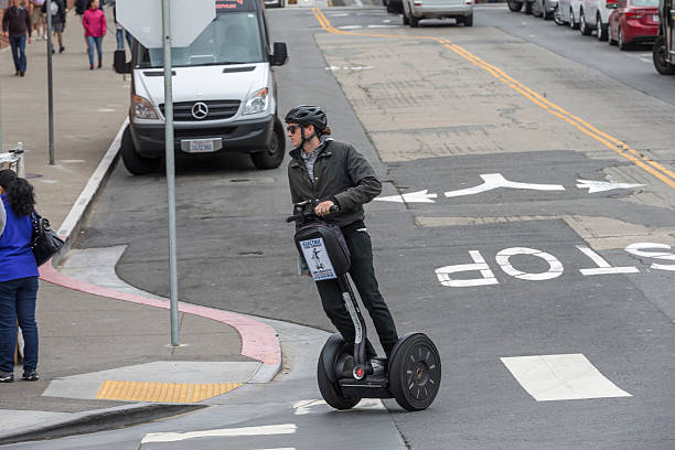 San Francisco, CA, USA - August 25, 2016: A tour guide running Segway on the downtown street of San Francisco.