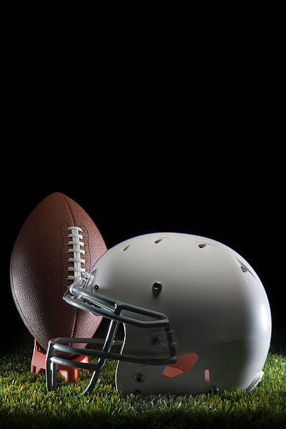 istock College Football and Helmet 596057564