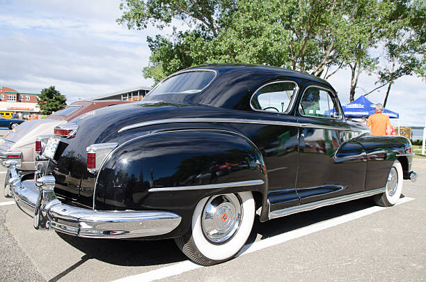 Antique Car: 1946 Chrysler New Yorker Rimouski, Canada - August 7, 2016: This is at an Antique Car Show Exposition during a weekend in Rimouski.  new york state license plate stock pictures, royalty-free photos & images