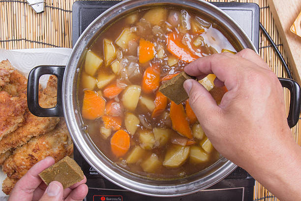 istock Chef putting Japanese curry pasted for cooking 596061504