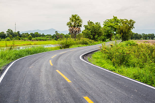 istock Asphalt road on countryside in thailand. 596065510