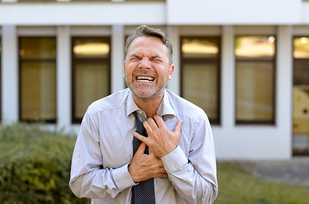 istock Middle-aged businessman suffering chest pains 596066042