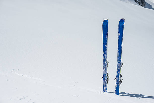 istock Skis planted in the snow 596067666