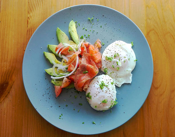 Poached eggs with avocado, tomato, red onion and smoked salmon