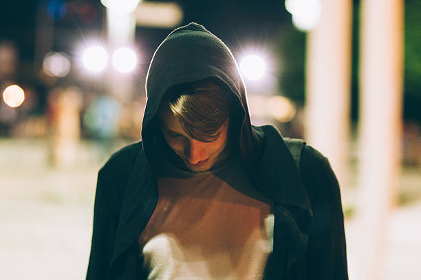 istock Young handsome man in hood outdoors 596068506