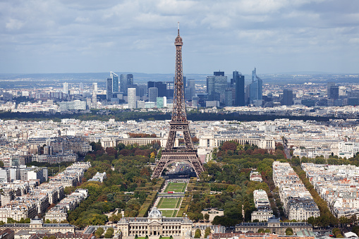 Eiffel tower as seen from Montparnasse Tower. La Defense business district seen on background.