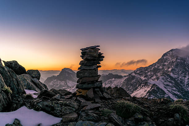 Cairn at sunrise on Parpaner Rothorn in the Alps Cairn at sunrise on the Parpaner Rothorn mountain peak in the Alps - 1 arosa photos stock pictures, royalty-free photos & images