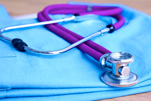 istock Medical stethoscope rests on a uniform close-up 596082244