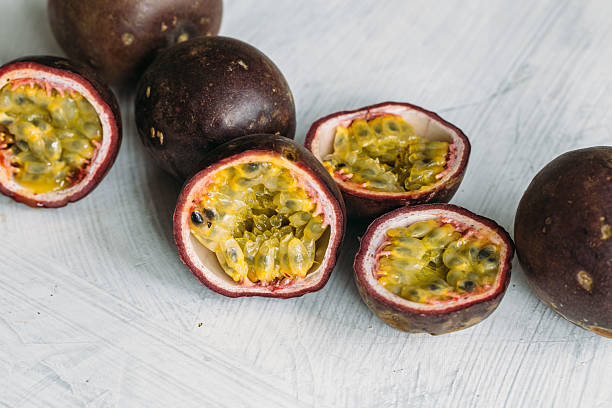 istock Fresh juicy passion fruits. Tropic fruit concept 596084664