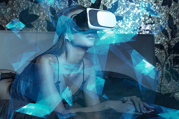 istock Woman wearing VR glass in bed 596085332
