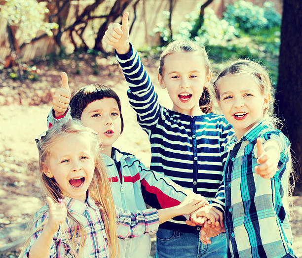 istock Happy  children holding hands and giving friendship 596086238
