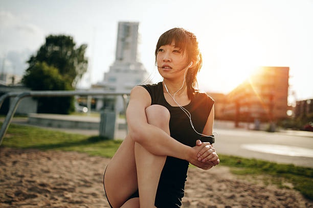 istock Fitness female relaxing after workout. 596086410