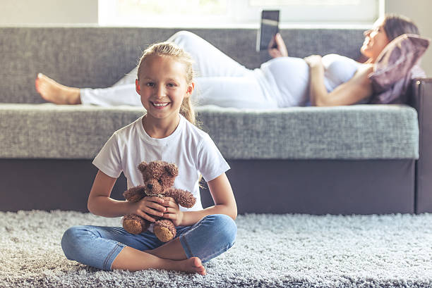 istock Pregnant woman with daughter 596086478