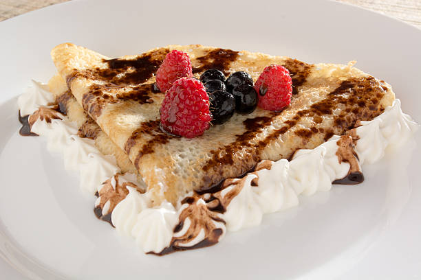 istock Fresh, golden pancakes with fruit and cream 596088330