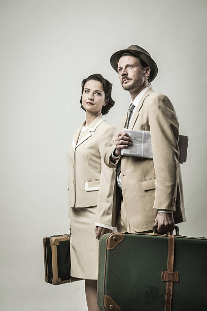 istock Elegant couple leaving with luggage 596090514