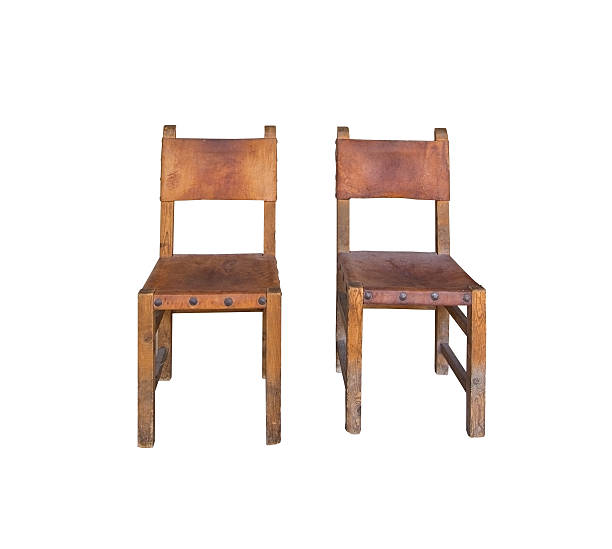 istock Two old leather and wood chairs 596091286