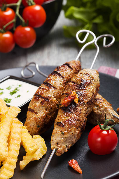 istock Barbecued kofta - kebeb with fries and vegetables 596092374