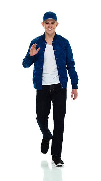 istock Smiling male walking and waving hand 596093248