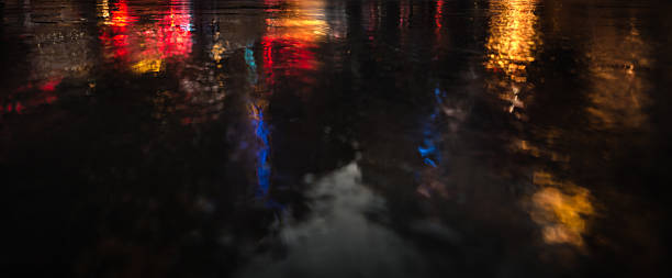 istock NYC streets after rain with reflections on wet asphalt 596093496