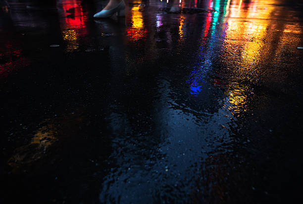 istock NYC streets after rain with reflections on wet asphalt 596093672