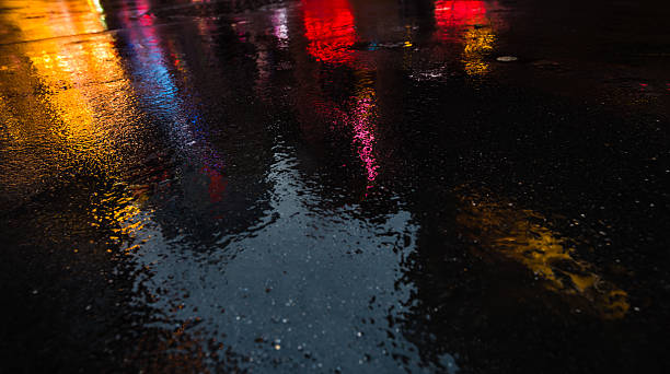 istock NYC streets after rain with reflections on wet asphalt 596093780