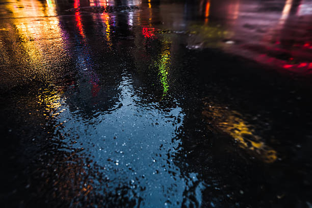 istock NYC streets after rain with reflections on wet asphalt 596093842