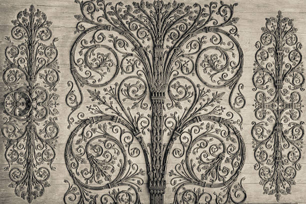 Black and white image of an artfully made wrought iron door.