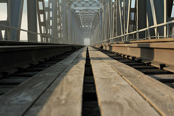 The railroad through the river. Железная дорога через реку. The railroad through the river. Железная дорога через реку. anyway stock pictures, royalty-free photos & images