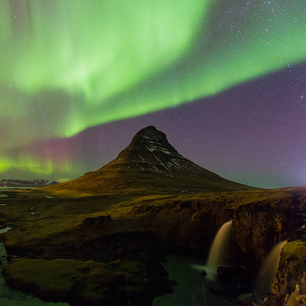 istock Green Northern lights over Kirkjufell volcano 596095718