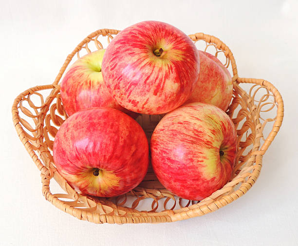 istock Fresh ripe red apples in the basket. 596096060