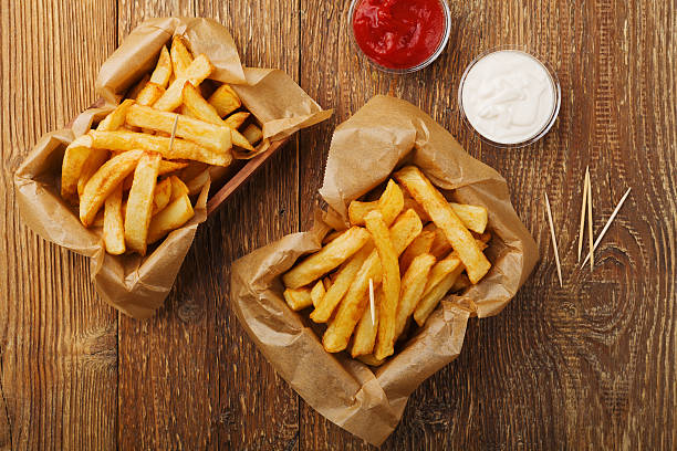 istock Serving Belgian fries served in a paper box. 596097686