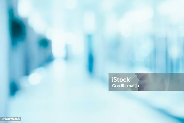 Medical Blurred Background Empty Hospital Corridor In Neon Blue Stock Photo - Download Image Now