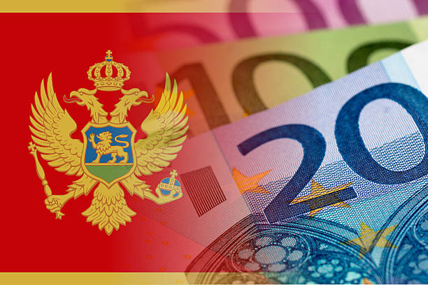 istock montenegro flag with euro banknotes 596339460