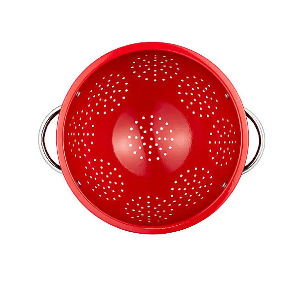 red colander isolated on white background (with clipping path)