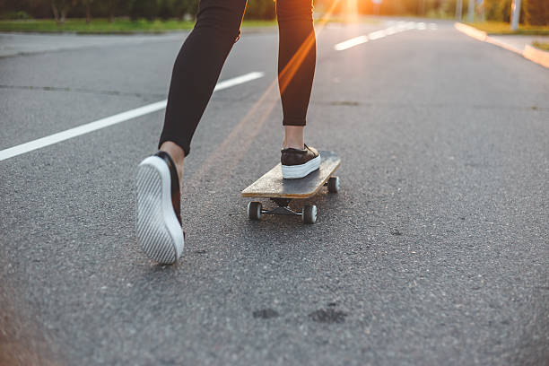 istock young skateboarder legs riding on skateboard in front of the 596342610