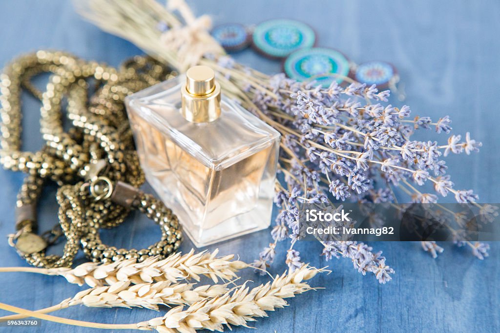 perfume with a bouquet of lavender and jewelry Adult Stock Photo