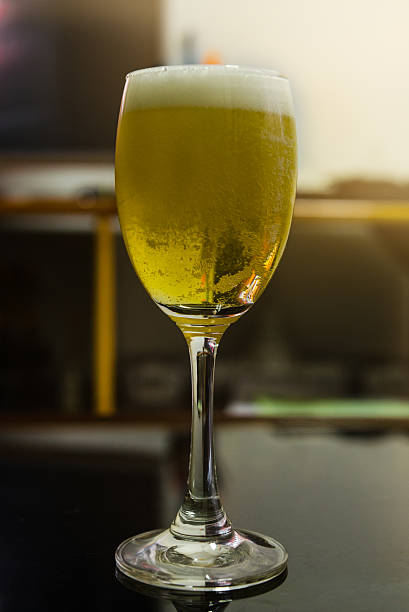 istock Glass of light beer in restaurant 596344306
