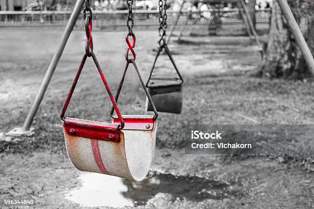 Old Red Swing At Playground Stock Photo - Download Image Now - Attitude, Black And White, Black Color