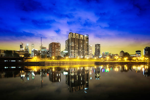 istock Montreal Griffintown skyline at night with reflection in water 596345110