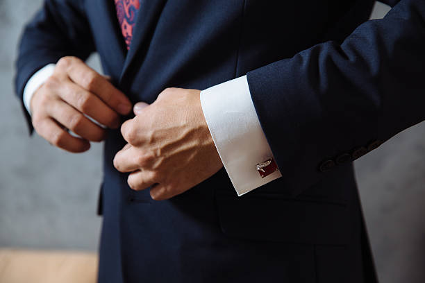 istock Businessman hands with cufflinks. Elegant gentleman clother 596345618