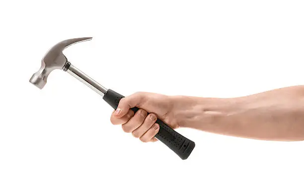 Close-up view of a man's hand holding hammer, isolated on white background. Repairing and maintenance. Building and destroying.