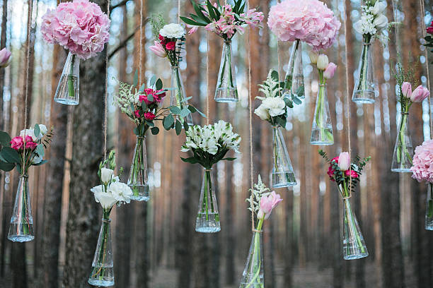 Wedding flowers decoration arch in the forest. Wedding flowers decoration arch in the forest. The idea of a wedding flower decoration. wedding concept in nature. natural arch photos stock pictures, royalty-free photos & images