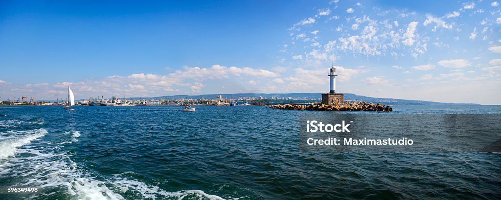 lighthouse on Varna port Landscape view of Varna bay, lighthouse on the port of city. Black sea, Bulgaria Backgrounds Stock Photo