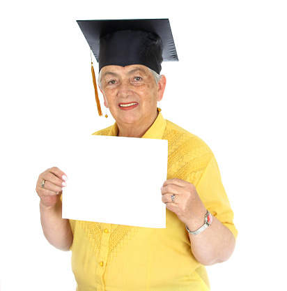 Mature woman wearing cap over white background