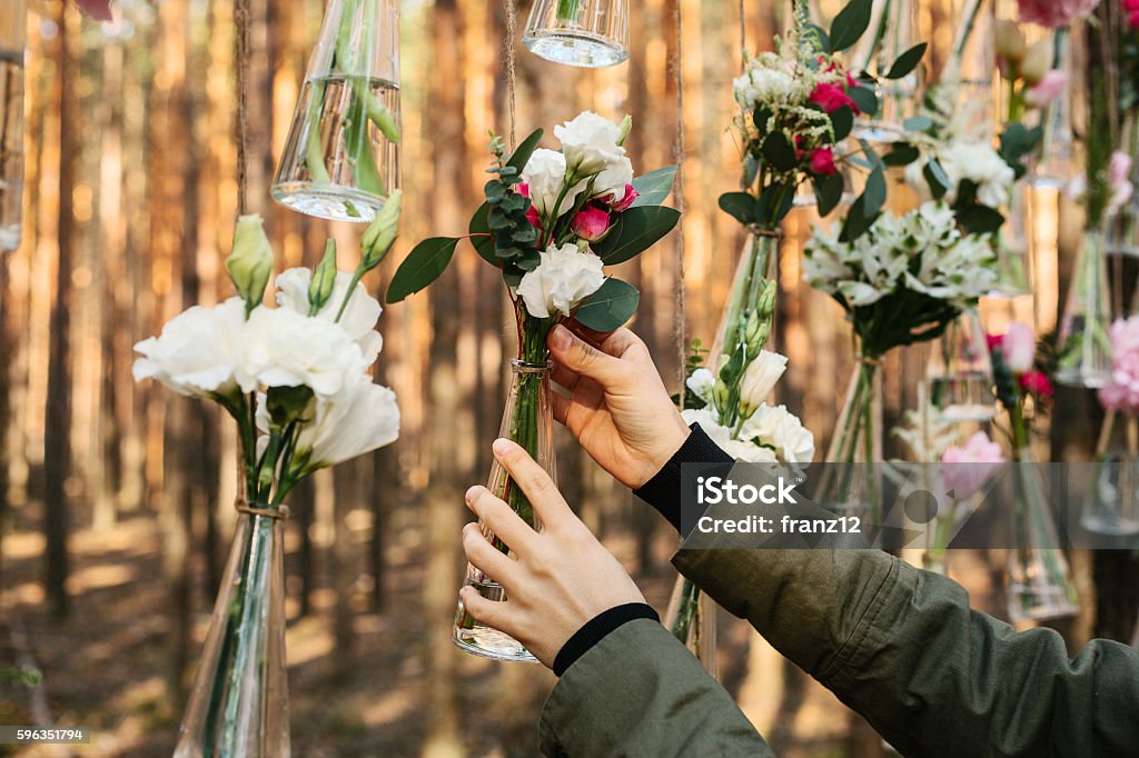 Wedding flowers decoration arch in the forest. Wedding flowers decoration arch in the forest. The idea of a wedding flower decoration. wedding concept in nature. Arch - Architectural Feature Stock Photo