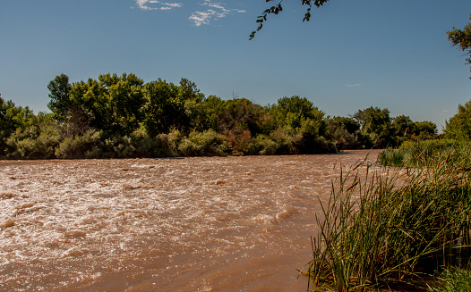Ample rainfall in late August 2016 sent water rushing down the Rio Grande to the Percha Diversion Dam south of Truth or Consequences and north of Las Cruces in New Mexico. This scene at Percha Dam State Park shows rushing water below the dam. Due to torrential rainfall upstream, the Rio Grande at times reached flood stage..