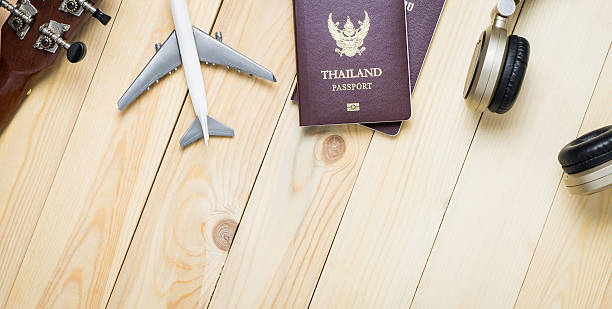 istock Travel objects equipments on wooden table with copy space. 596354436