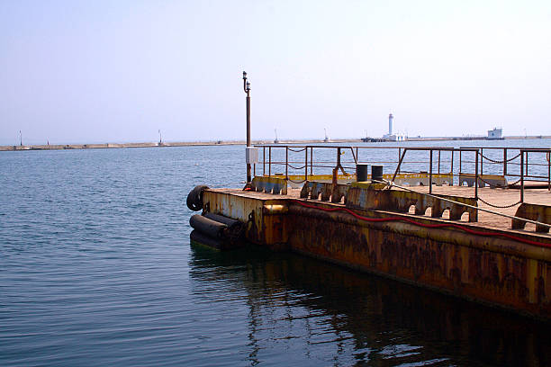 istock The old sea pier in the port. 596355550